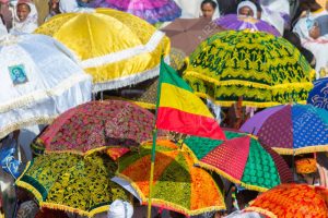 Gonder, Ethiopia - January 19, 2012: group of unidentified people under colorful umbrellas during the Timkat holiday, the important Ethiopian Orthodox celebration of Epiphany.